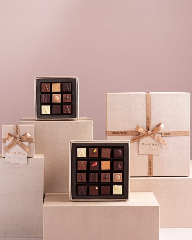 Video depicting different boxes of chocolates that seem to come to life and open up allowing chocolates to seemingly fly out into a colourful space